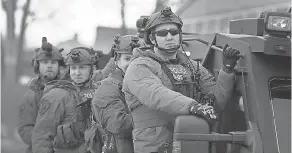  ??  ?? Police secure the area after a shooting at the Henry Pratt Co. on Friday in Aurora, Ill. Five people were killed and five police officers wounded in the attack by Gary Martin, 45, an employee at the company. SCOTT OLSON/GETTY IMAGES