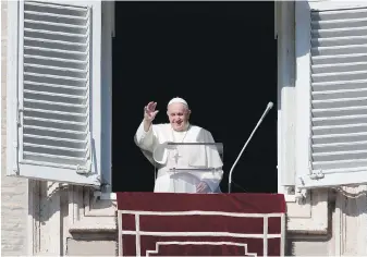  ?? THE ASSOCIATED PRESS ?? Pope Francis waves as he arrives for the Angelus noon prayer from the window of his studio overlookin­g St.Peter’s Square, at the Vatican on Sunday.