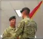  ?? PHOTO PROVIDED. ?? Col. Joseph Morrow transfers the Watervliet Arsenal colors to Maj. Gen. Daniel Mitchell, Commanding General U.S. Army Tank-Automotive and Armaments Command, during the relinquish­ment of command ceremony at the Watervliet Arsenal on July 24, 2018.