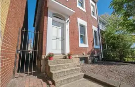  ?? Jake Mysliwczyk ?? The three-story house at 1831 Blvd. of the Allies in Uptown faces the Mon River and South Side.