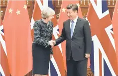  ??  ?? Chinese President Xi Jinping (right) shakes hand with British Prime Minister Theresa May before their meeting at the West Lake State House on the sidelines of the G20 Summit, in Hangzhou, Zhejiang province, China, September 5, last year. — Reuters photo