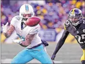  ?? CHARLES TRAINOR JR. / MIAMI HERALD ?? Miami receiver Kenny Stills catches a third-quarter pass in front of the Steelers’ Artie Burns on Sunday. It’s not clear if Stills will re-sign with the Dolphins during the offseason.