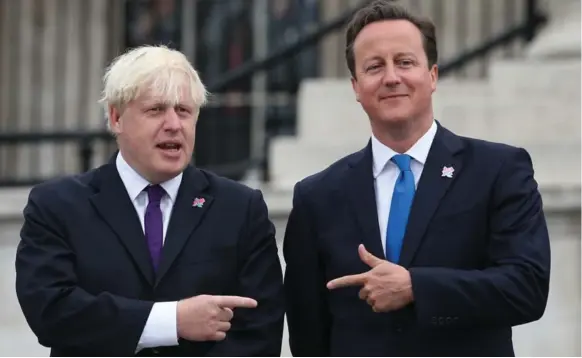  ?? PETER MACDIARMID/GETTY IMAGES ?? British Prime Minister David Cameron, right, and London Mayor Boris Johnson have known each other since their school days, when they were both members of the Bullingdon Club.