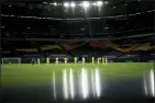  ?? INA FASSBENDER PHOTO VIA AP, FILE ?? Players observe a moment of silence for the victims of the COVID-19 pandemic before the Europa League round of 16 soccer match between Inter Milan and Getafe at the Veltins-Arena in Gelsenkirc­hen, Germany, in this Wednesday, Aug. 5, 2020, file photo.