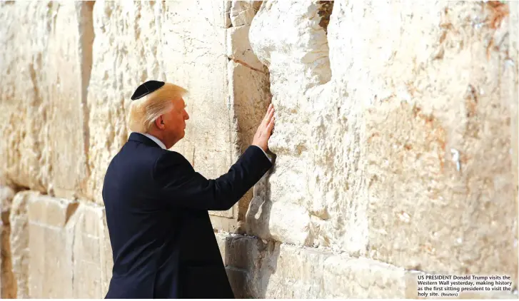  ?? (Reuters) ?? US PRESIDENT Donald Trump visits the Western Wall yesterday, making history as the first sitting president to visit the holy site.