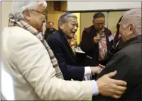  ??  ?? Mike Honda, far left, Norman Y. Mineta, center, and Yoshihiro “Yosh” Uchida, far right, chat after the 40th Annual San Jose Day of Remembranc­e at the San Jose Buddhist Church Betsuin in San Jose, on Feb. 16.