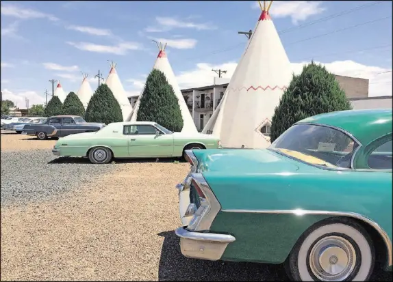  ?? ANDREA SACHS/WASHINGTON POST ?? Guests sleep in 15 teepees at the Wigwam Motel, part of a chain built in the 1930s. Vintage cars add to the old-timey feel. Only three of the properties still survive, including this one in Holbrook, Ariz.