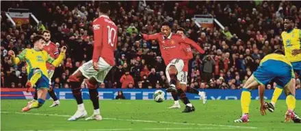  ?? REUTERS PIC ?? Manchester United’s Anthony Martial scores against Nottingham Forest during Wednesday’s League Cup semi-final at Old Trafford.