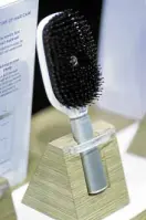  ?? —AP ?? The Hair Coach smart hairbrush displayed at the Withings booth