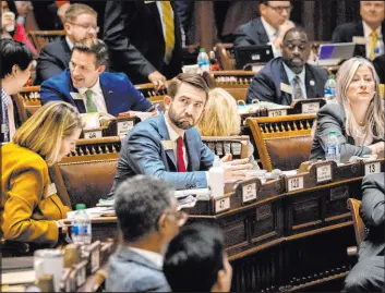  ?? Arvin Temkar The Associated Press ?? State Rep. Houston Gaines, R-athens, watches the voting board for HB 1105, which would penalize sheriffs who don’t coordinate with ICE over illegal immigrants.