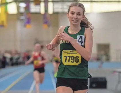  ?? CINCLAIR/TELEGRAM & GAZETTE ?? Nashoba’s Caroline Collins wins the 2 mile at Saturday’s Meet of Champions.RICK