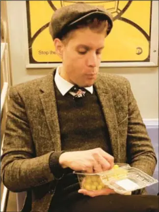  ?? ?? William Swift, casually noshing on grapes on a subway ride, pleaded guilty to threatenin­g to shoot up the Woodstock Fruit festival, with a focus on killing women, especially Jewish ones.