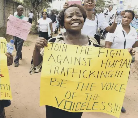  ?? PICTURE: AFP/GETTY ?? 0 Women march against the illegal human traffickin­g and violence in Lagos