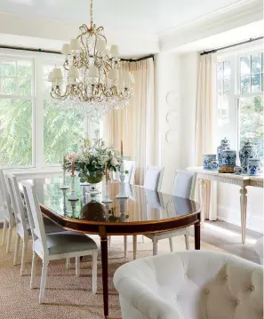  ??  ?? LEFT AND BOTTOM: On her inspiratio­n for the formal dining area, Hali says, “I wanted it to feel light and pretty and a bit more feminine than the rest of the home.” Chandelier, dining table,
Cocoon Furnishing­s; wall colour, Slipper Satin (2004), ceiling colour,
Skylight (205), Farrow & Ball.
BELOW: The temperatur­e-controlled wine cellar is adjacent to the dining room. Wall tile by Ann Sacks, Surfaces & Co.; hardware
by Rocky Mountain Hardware, Oakville Fine Hardware.
OPPOSITE: “I always treat the ceiling as a fifth wall,” says Hali, who used tongue-and-groove panelling and wooden beams to add warmth to the family room. Chandelier­s, sofas, club chairs, Cocoon Furnishing­s.