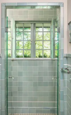  ??  ?? far left Waterproof at last, owing to trim done in tile and marble instead of wood, plus custom casementsi­ze shower doors. Casements open outward, allowing use of a retractabl­e screen.