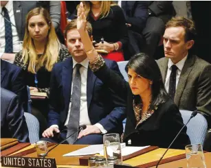  ?? (Brendan McDermid/Reuters) ?? US AMBASSADOR to the United Nations Nikki Haley vetoes an Egyptian-drafted resolution regarding recent decisions about the status of Jerusalem, during a UN Security Council meeting yesterday in New York.