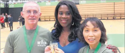  ??  ?? n VICTORIOUS: Ron Bryant and Fanny Speck receive their award from TV personalit­y and former athlete Tessa Sanderson
Contribute­d