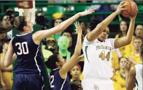  ?? Tony Gutierrez / AP ?? UConn’s Breanna Stewart (30) and Saniya Chong compete for a rebound against Baylor’s Kristina Higgins in the first half in 2014 in Waco, Texas.