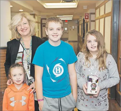  ??  ?? Dr. Anne Kwasnik-Krawczyk accepts a donation for the palliative care unit from Ava Simpson, and Ethan and Brooke Howes. The Aberdeen Health Foundation provided funding for Dr. Kwasnik-Krawczyk to complete a fellowship program that gave her the...