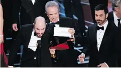  ?? CHRIS PIZZELLO / INVISION/ THE ASSOCIATED PRESS FILES ?? La La Land producer Jordan Horowitz, left, Warren Beatty and host Jimmy Kimmel at last year’s Oscars.