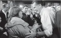  ?? By Justin Sullivan, Getty Images ?? A day before primary: Mitt Romney greets supporters during a town-hall-style meeting Monday in Green Bay, Wis.