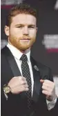  ??  ?? Canelo Alvarez (above) and WBC/ WBA middleweig­ht champion Gennady Golovkin (right) during a news conference at MGM Grand Hotel &amp; Casino.