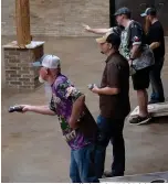  ?? Staff photo by Kelsi Brinkmeyer ?? ■ The game of cornhole has increased in popularity in recent years, with tournament­s even televised on ESPN. Here, local players test their skill at Crossties in downtown Texarkana.