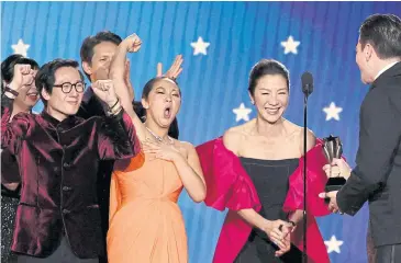  ?? Everything Everywhere All At ?? From right, Michelle Yeoh, Stephanie Hsu and Ke Huy Quan accept the Best Picture award for Once at the Critics Choice Awards in LA on Sunday.