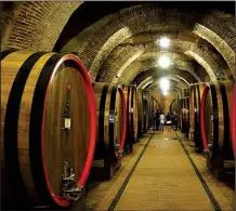  ?? Rick Steves’ Europe/RICK STEVES ?? In Montepulci­ano, huge casks hold raw wine for at least a year so that the wine can pick up the personalit­y of the wood as it ages.