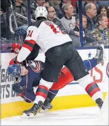  ?? CAIRNS/DISPATCH] [ADAM ?? The Blue Jackets’ Tyler Motte gets upended by the Devils’ Brian Boyle behind the net during the third period. Stefan Noesen, RW, Devils: Taylor Hall, LW, Devils: Cory Schneider, G, Devils: First period—