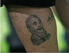  ?? Jeff Topping / The National ?? Maradona was also friends with Fidel Castro and has a tattoo of the former Cuban leader on his leg