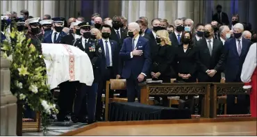  ?? AP PHOTO/JACQUELYN MARTIN ?? From left, President Joe Biden, first lady Jill Biden, Vice President Kamala Harris, her husband Doug Emhoff, and former President Bill Clinton, watch the casket of former Sen. Bob Dole of Kansas, arrive Friday at the Washington National Cathedral in Washington.