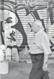  ?? LOUISA GOULIAMAKI, AFP/GETTY IMAGES ?? Graffiti symbols of the euro and the dollar in Athens on Monday.