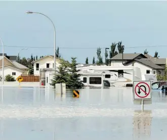  ?? Calgary Herald/Files ?? When the floods hit High River on June 20, local officials had a monumental task communicat­ing with citizens and protecting key infrastruc­ture such as the water supply and electrical system.