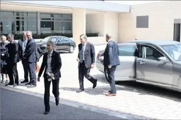  ??  ?? Mario Draghi, president of the European Central Bank, centre, arrives for a Eurogroup meeting of European finance ministers in Luxembourg last month. The bank left rates unchanged at yesterday’s meeting.