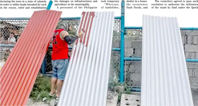  ?? ROMAN PROSPERO ?? Fresh coat A worker paints roof sheets for a house in Navotas.