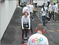  ??  ?? HNA employees in Dublin, Ireland, help to refurbish the local Christian Brothers’ School.