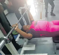  ??  ?? DREAM CHANCE: Cape Recife High School pupil Mbasa Qilingele hard at work in training for the internatio­nal powerlifti­ng tournament in Finland next month