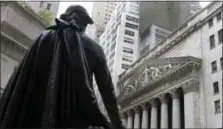  ?? RICHARD DREW — THE ASSOCIATED PRESS FILE ?? In this file photo, the statue of George Washington on the steps of Federal Hall faces the facade of the New York Stock Exchange. Weak results and forecasts from companies send stocks slightly lower in early trading on Wall Street, Thursday.