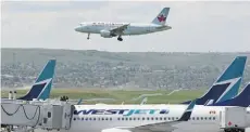  ?? DEAN BICKNELL/POSTMEDIA NEWS ?? Both Air Canada and WestJet have been downgraded by Glenn Engel, Bank of America Merrill Lynch analyst.