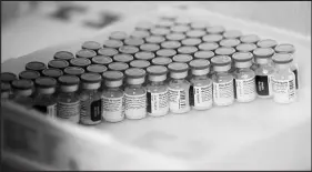  ?? KEVIN MOHATT / THE NEW YORK TIMES ?? Vials of the Pfizer-biontech COVID-19 vaccine sit in a tray in Denver. Financial and bureaucrat­ic barriers in the United States mean that the next generation of COVID vaccines may be designed here but used elsewhere.