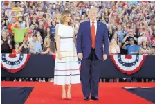  ?? CAROLYN KASTER/ASSOCIATED PRESS ?? President Donald Trump and first lady Melania Trump arrive at an Independen­ce Day celebratio­n in front of the Lincoln Memorial.