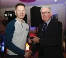  ??  ?? Hurling Team member Stephen O’Reilly receiving his medal at the Kilbrin GAA night.