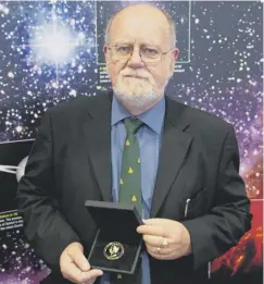  ??  ?? 0 Professor John Brown pictured after receiving the Gold Medal of the Royal Astronomic­al Society in 2012