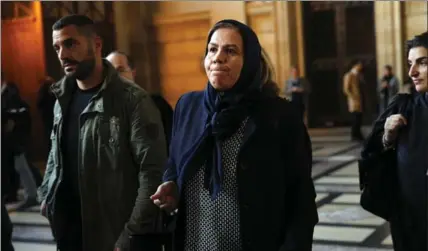  ?? CHRISTOPHE ENA, THE ASSOCIATED PRESS ?? Latifa Ibn Ziaten, mother of French paratroope­r Imad Ibn Ziaten who was killed by Mohammed Merah arrives at the courthouse in Paris, Thursday.