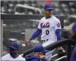  ?? SETH WENIG - THE ASSOCIATED PRESS ?? New York Mets starting pitcher Marcus Stroman leaves the field at the start of a rain delay during the first inning of a baseball game against the Miami Marlins at Citi Field, Sunday, April 11, 2021, in New York. The game was delayed at the top of the first inning due to rain.