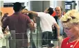  ??  ?? The passenger allegedly being punched by a member of airport staff