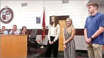  ?? Janelle Jessen/Siloam Sunday ?? School board members recognized students Katherine Arrington (left), Emma Hulbert and Mason Cooper during Tuesday’s meeting for being named 2020 National Merit Scholarshi­p Semifinali­sts.