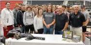  ?? TIMES photograph by Annette Beard ?? Matt Dixon and his parents, Shawn and Jenny Dixon, were joined in celebratin­g his signing to play ball at the University of the Ozarks, Clarksvill­e, by his coaches Blake Rudolph, Garrett King and Matt Easterling and team mates. For more photograph­s, go to the PRT gallery at https://tnebc.nwaonline.com/photos/.