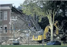  ?? DAVID JOLES/THE ASSOCIATED PRESS ?? A part-time janitor and a receptioni­st were killed Wednesday after a natural gas explosion at Minnehaha Academy in Minneapoli­s. Minn.